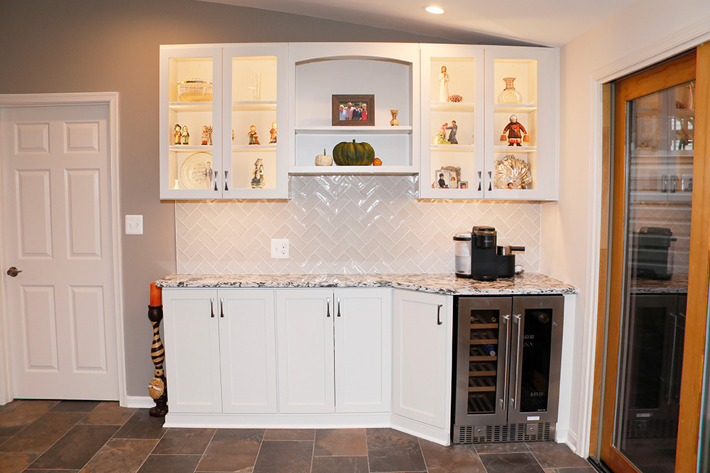 Lighted cabinets with lazy susan and wine refrigerator replaced an old hutch.