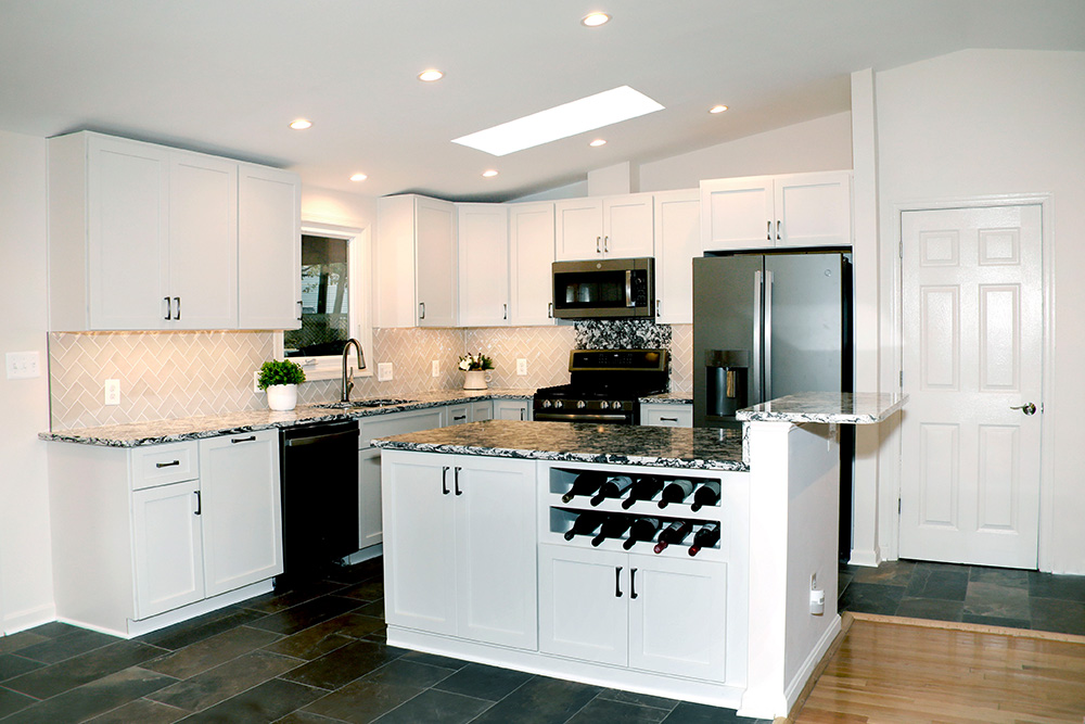 A modernized kitchen with stainless appliances and ample cabinet space brings back the joy of cooking.