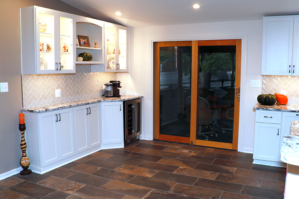 Beautiful tile floors and lighted cabinetry stand ready for the next family gathering.