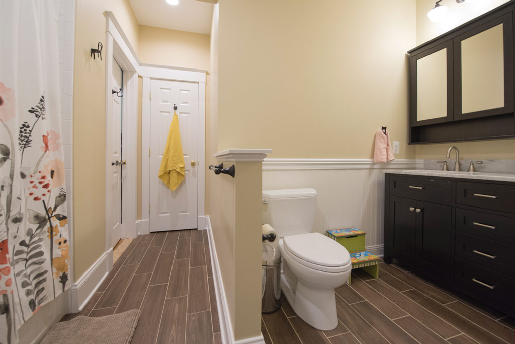 A new bathroom with shower is adjacent to the game room.
