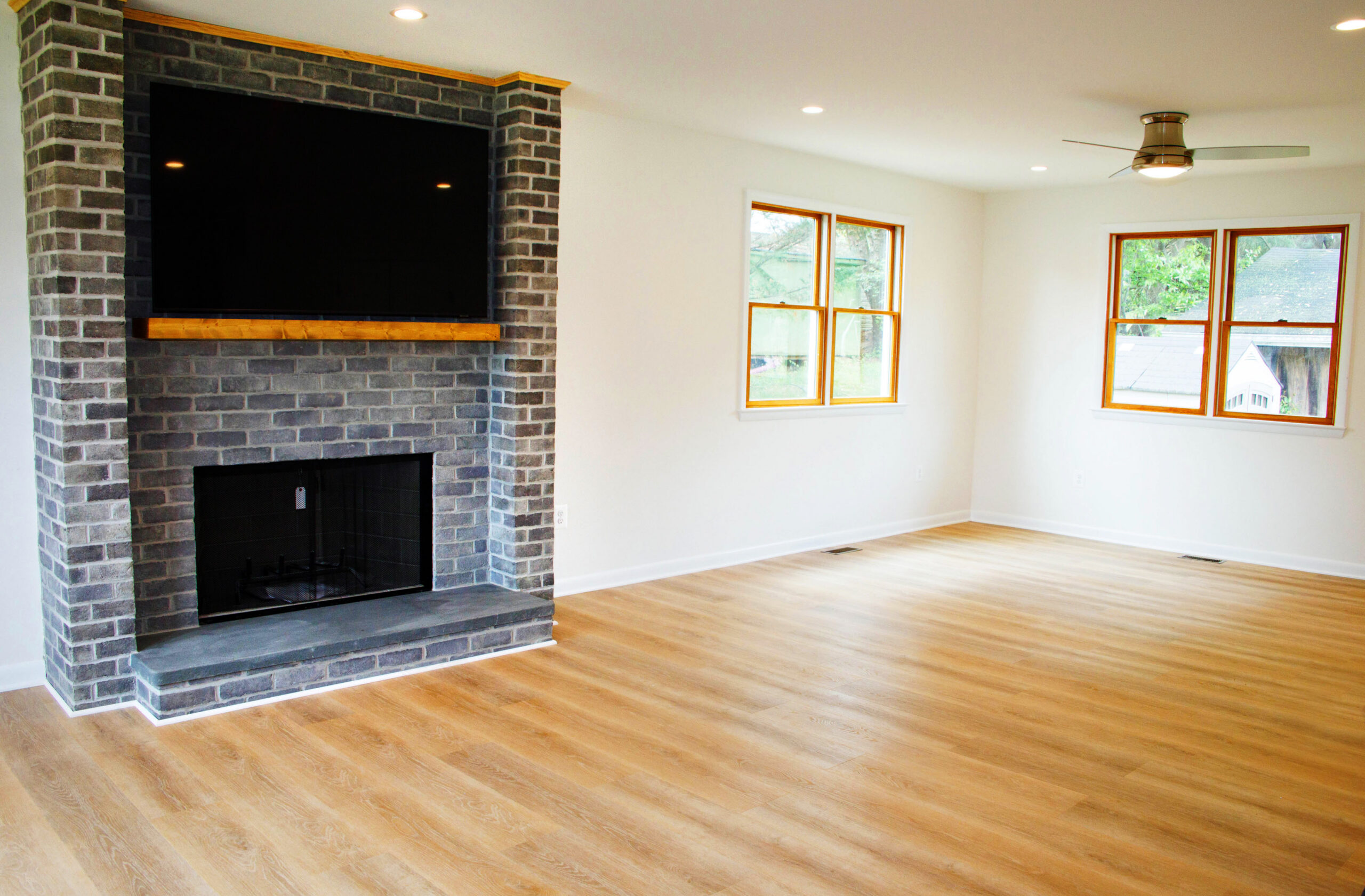 Fireplace and wood cased windows in the living room