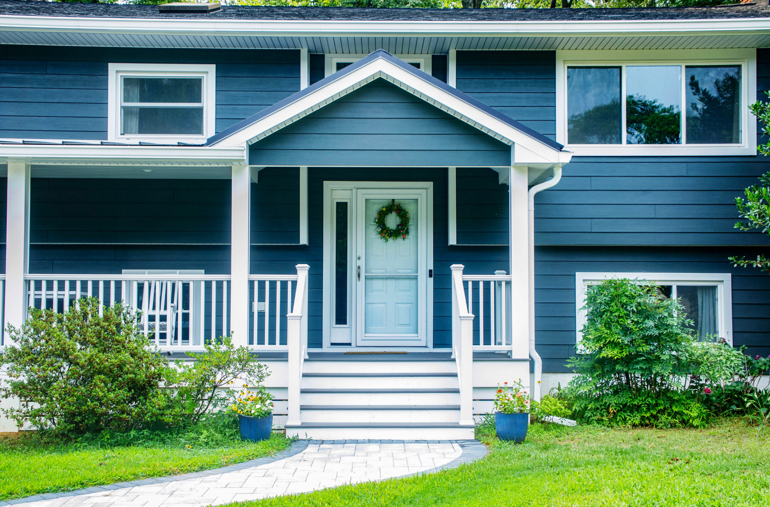 New gabled front porch on this raised ranch remodel